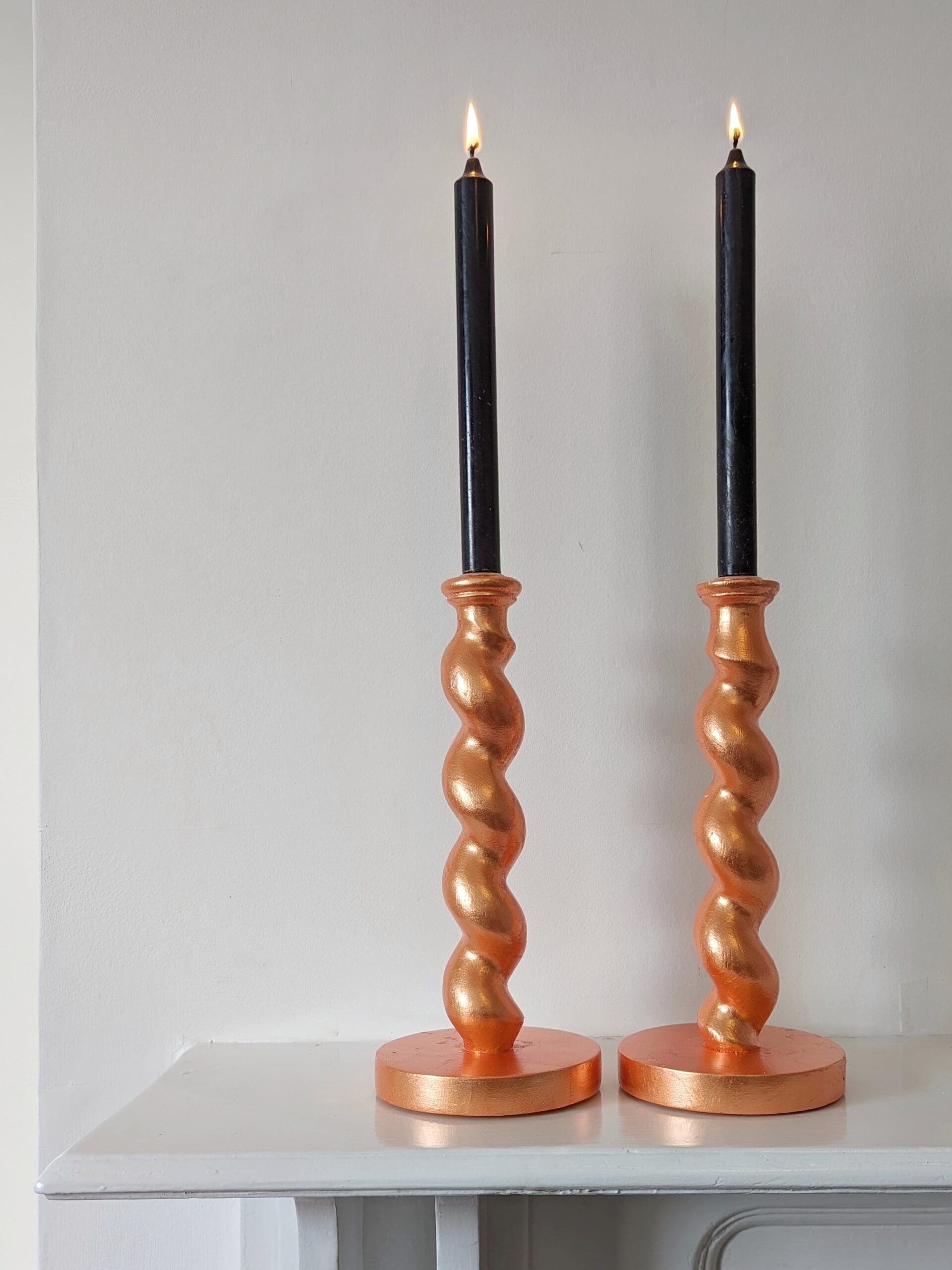 peach candlesticks with black candles